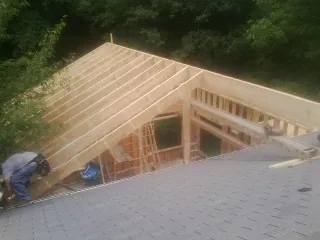 Framing a new roof addition that ties into an existing shingle roof in Buena Vista